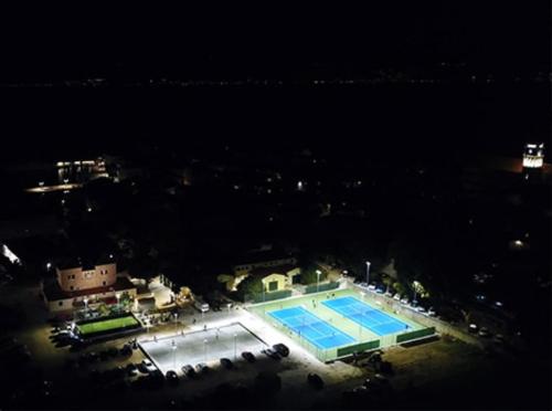 an overhead view of a swimming pool at night at Apartments Ita - Postira in Postira