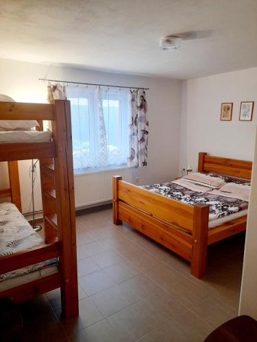 Postel nebo postele na pokoji v ubytování Apartmán u Zdeňků