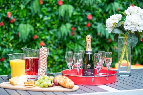 a table with wine glasses and a tray of food at Georgian Apartment Catharine St in Liverpool