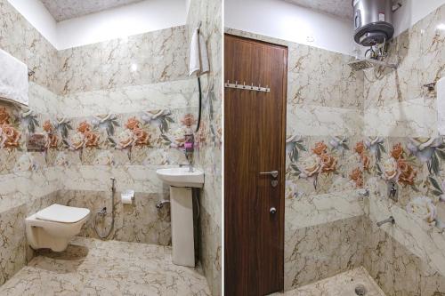 a bathroom with a toilet and a sink and a shower at FabHotel The Dreams in Chandīgarh