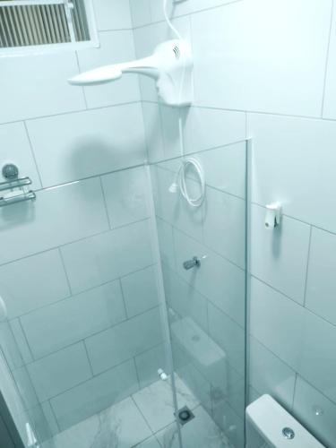 a bathroom with a shower with a glass door at Flat Duplo para sua conexão in Guarulhos