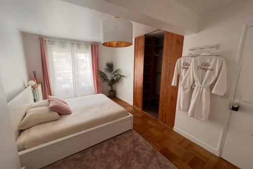 a small bedroom with a bed and a closet at Pavillons19 Paris Disney Airport AND Spa in option 50day in Les Pavillons-sous-Bois