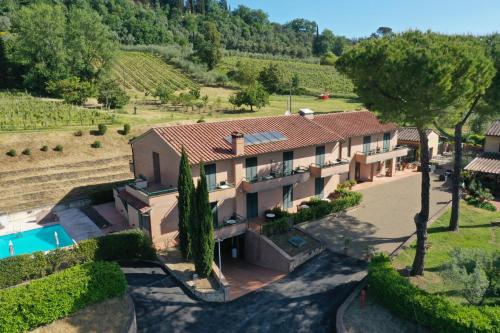 an aerial view of a villa with a swimming pool at Hotel Le Colline in San Gimignano