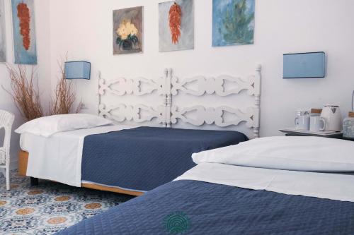 Postel nebo postele na pokoji v ubytování Agriturismo Fattoria Terranova