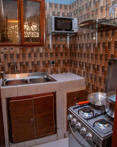 Köök või kööginurk majutusasutuses Sawadogo meublée