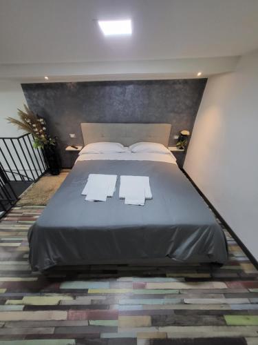 a bedroom with a large bed with two white pillows at L'Approdo di Dante in Naples
