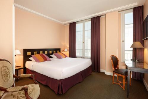 Ένα ή περισσότερα κρεβάτια σε δωμάτιο στο Hotel De La Jatte