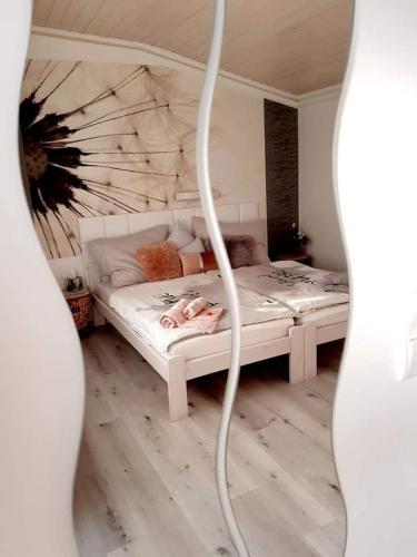 a bedroom with two beds in a room at Magnólia Vendégház in Villány