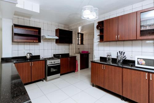 Kuchyň nebo kuchyňský kout v ubytování Migano Residence