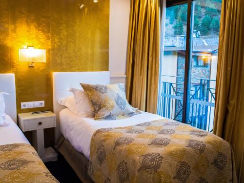Ένα ή περισσότερα κρεβάτια σε δωμάτιο στο Hotel Princesa Parc Excellence