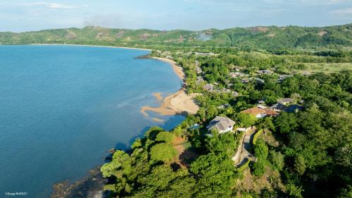 an aerial view of the shoreline of a beach at Home The Residence in Befotaka Bay