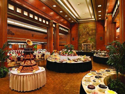 a large room filled with tables filled with food at The Queen Mary in Long Beach