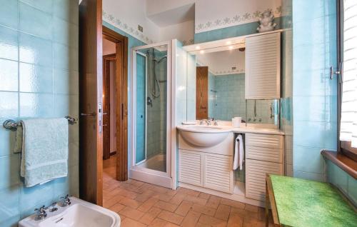 a bathroom with a sink and a toilet and a shower at Villa Millefiori in Spoleto