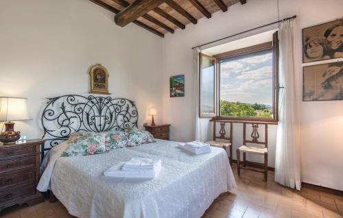 a bedroom with a large bed and a window at Villa Millefiori in Spoleto