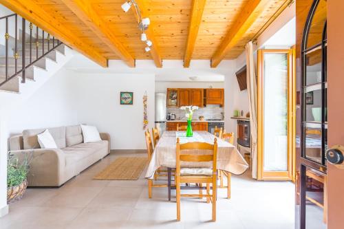 a living room with a table and a couch at Starhost - La Casella seaview garden terrace and parking in Cetara