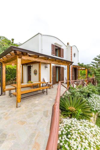 a house with a fence in front of it at Starhost - La Casella seaview garden terrace and parking in Cetara
