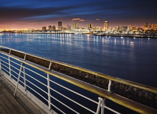 a view of a city from a pier at night at The Queen Mary in Long Beach