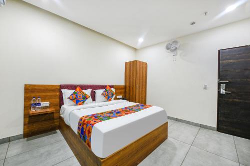 a bedroom with a large bed in a room at Hotel HC Dream Majestic in Mohali