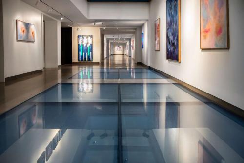 a hallway with a swimming pool in a building at The Bankers Alley Hotel Nashville, Tapestry Collection by Hilton in Nashville