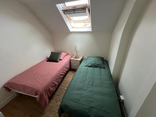 Ένα ή περισσότερα κρεβάτια σε δωμάτιο στο Appartement 3 Pièces Bord de mer Place du 6 Juin