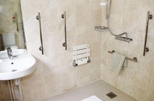 a bathroom with a sink and a shower at Middledown in Alton