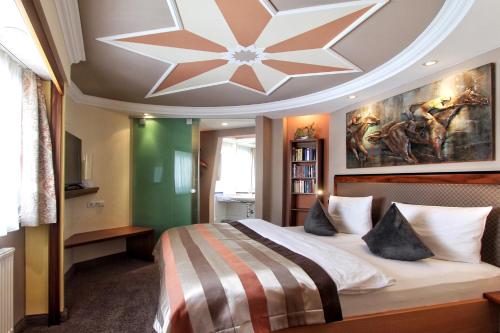 a bedroom with a large bed with a large ceiling at Grütter Luxury Apartments in Ischgl