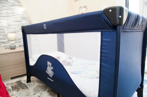 a blue bunk bed in a room with a bed at Luxury house Il tramonto - Daniele Case Vacanza in Anzio