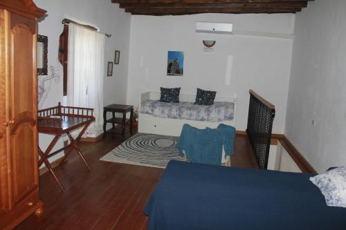 Postel nebo postele na pokoji v ubytování Casa los Abuelos