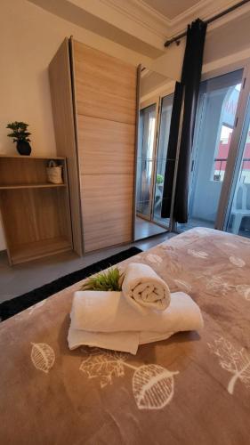 a towel sitting on the floor of a bedroom at Appart Hotel Tanger Paname in Tangier