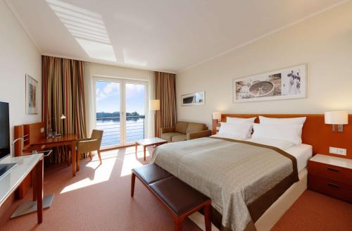 Postel nebo postele na pokoji v ubytování ATLANTIC Hotel Wilhelmshaven