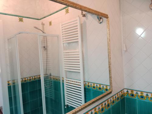 a bathroom with a mirror and a shower at Creta Rossa in Larino