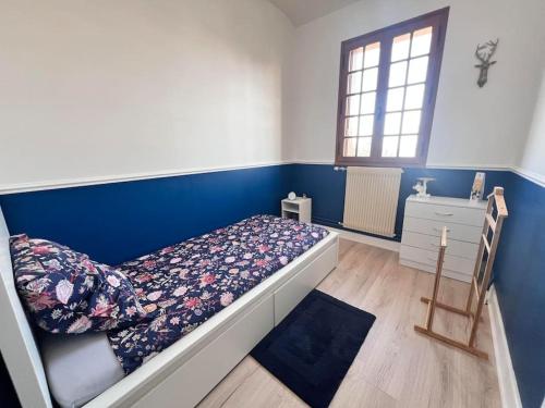 Ένα ή περισσότερα κρεβάτια σε δωμάτιο στο Maison au pied des Vignes