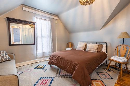 a bedroom with a bed and a window at New Listing!! Bright Bohemian Stay in Laramie