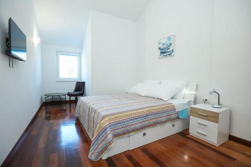 Ένα ή περισσότερα κρεβάτια σε δωμάτιο στο Apartments Seafront