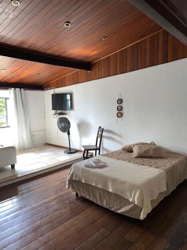 A bed or beds in a room at Castelinho de Ibicuí