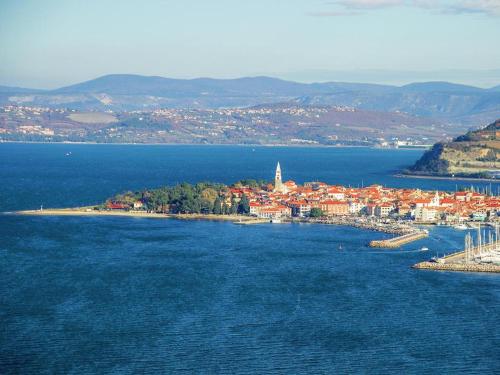 an island in the middle of a body of water at Villa Noa jacuzzi & sauna in Izola