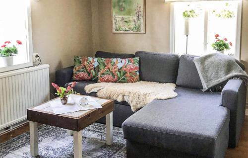 a living room with a couch and a coffee table at Awesome Home In Visby With Kitchenette in Vall