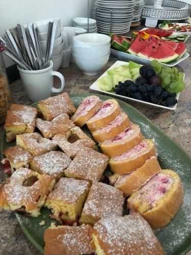 a plate of pastries sitting on top of a table at Pension Laubenhof in Mörbisch am See