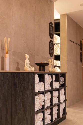 a room with a shelf filled with towels at Resort Český les in Bělá nad Radbuzou