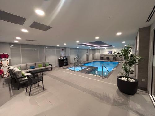 a living room with a swimming pool in a building at Hampton Inn By Hilton Kingston in Kingston