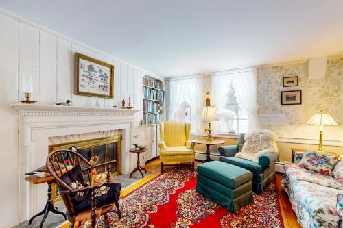 a living room with a couch and a fireplace at Kenlo Farm 