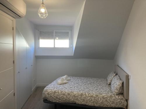 Ένα ή περισσότερα κρεβάτια σε δωμάτιο στο San Sebastián 6 Apartments