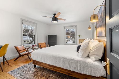 a bedroom with a bed and a dining room at Launchpoint Lodge in Lincoln