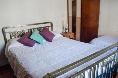 سرير أو أسرّة في غرفة في Villa Narcisa