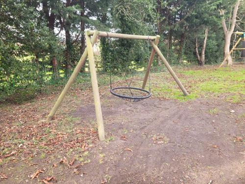 an empty swing set in a park at 17th-Century1Bed Studio PetsOk Garden Wifi in Elkesley