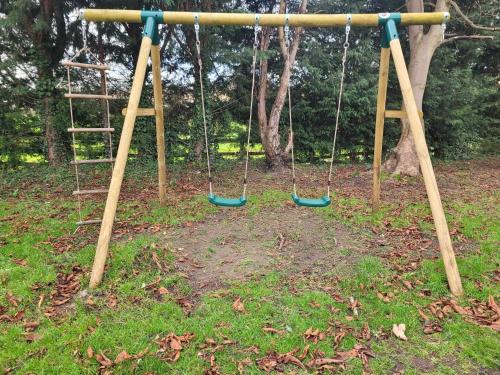 an empty swing set in a park at 17th-Century1Bed Studio PetsOk Garden Wifi in Elkesley