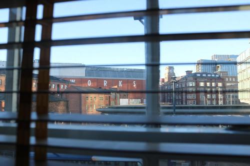 a view of a city from a window at Lower Turks Head in Manchester