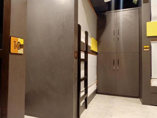 a hallway with two elevators in a building at Stayvilla Hostel in Mumbai