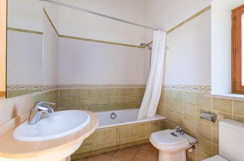 a bathroom with a sink and a toilet at YourHouse Son Tey Villa in Sineu