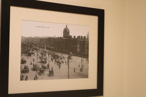 a black and white picture of a city with people at Lower Turks Head in Manchester